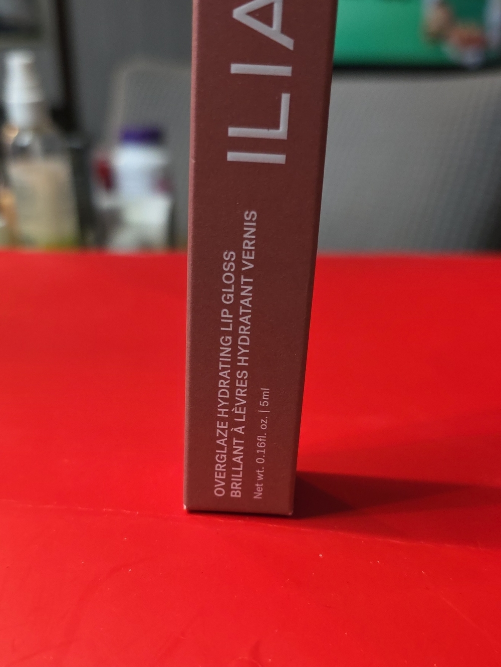 ILIA Lip Gloss Packaging in Mauve Brown (Brown, Pink)